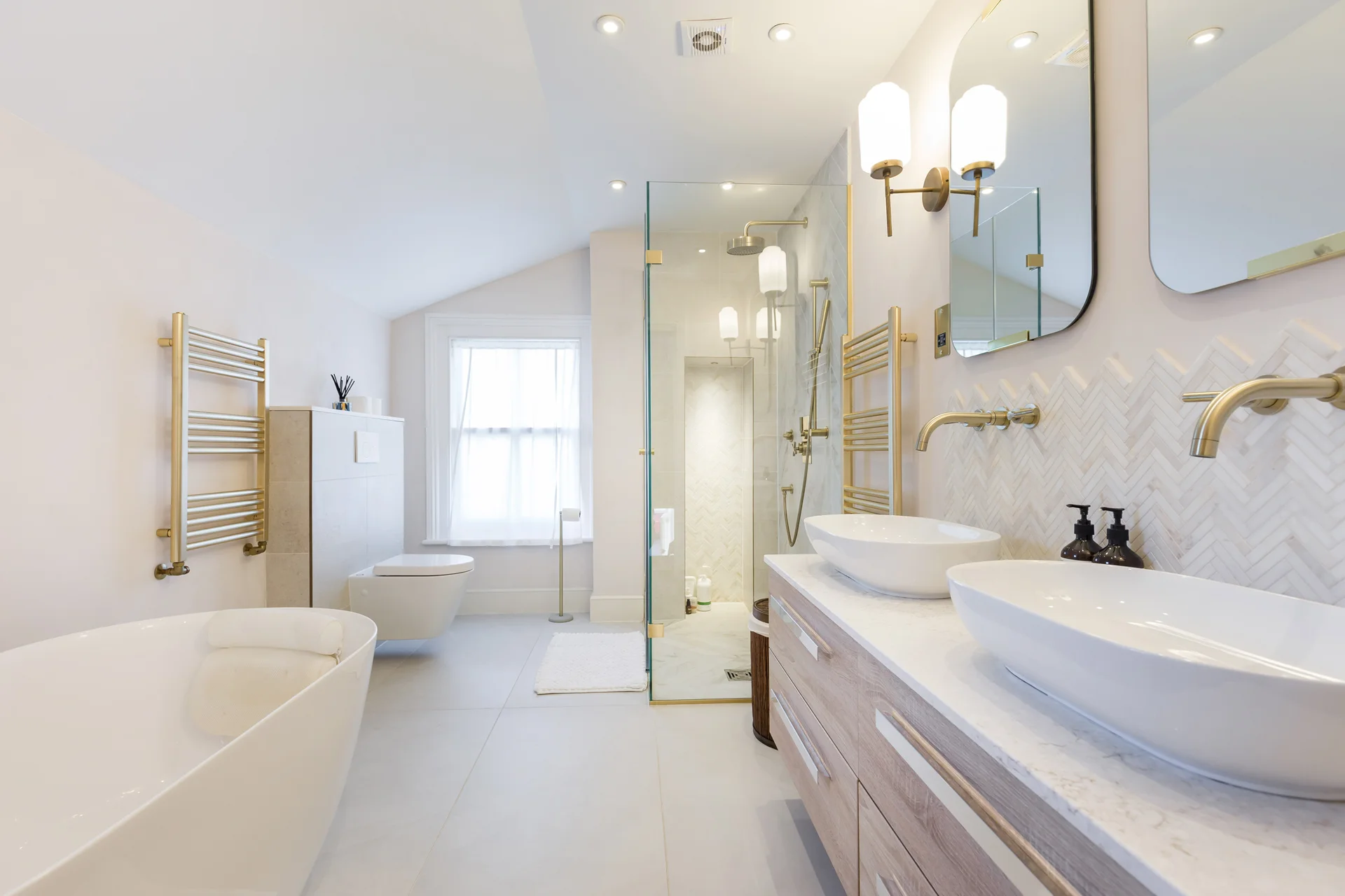 Modern bathroom refurbishment in London by Elest Group with walk-in shower and double vanity
